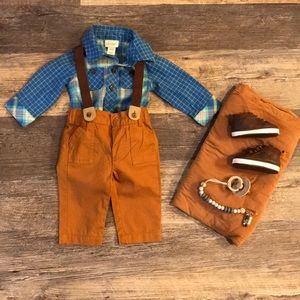 Boys newborn outfit with suspenders.